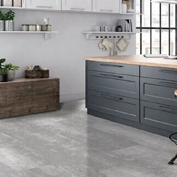 SPC flooring with a light, weathered gray wood in a kitchen