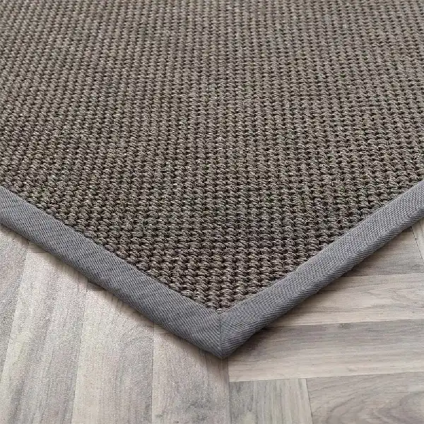 Brown sisal carpet with tight weave and gray border