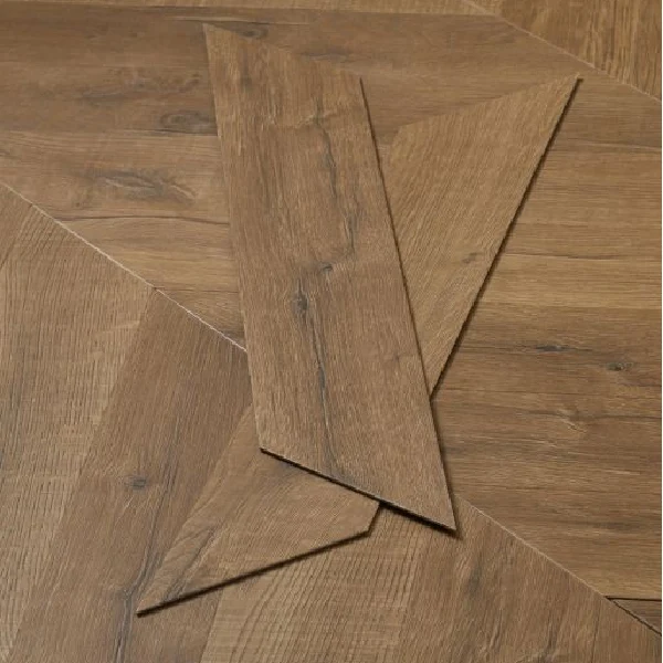 Brown wood-look vinyl planks in a chevron pattern.