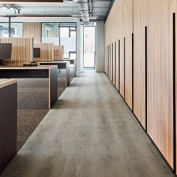 Commercial office with gray wood-look vinyl flooring.