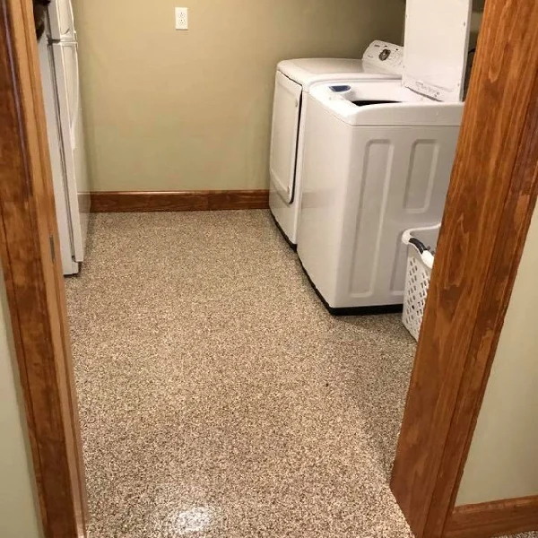Epoxy flake floor in a laundry room with washer