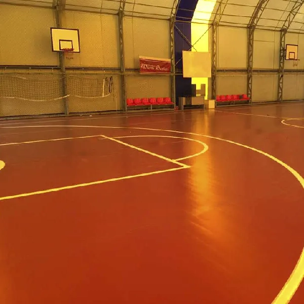 Glossy redGlossy reddish-brown gymnasium floor with white court lines