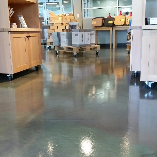 Gray, glossy epoxy floor in a commercial storage area.