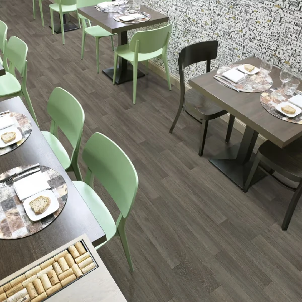 Gray wood-look vinyl plank flooring in a restaurant dining area