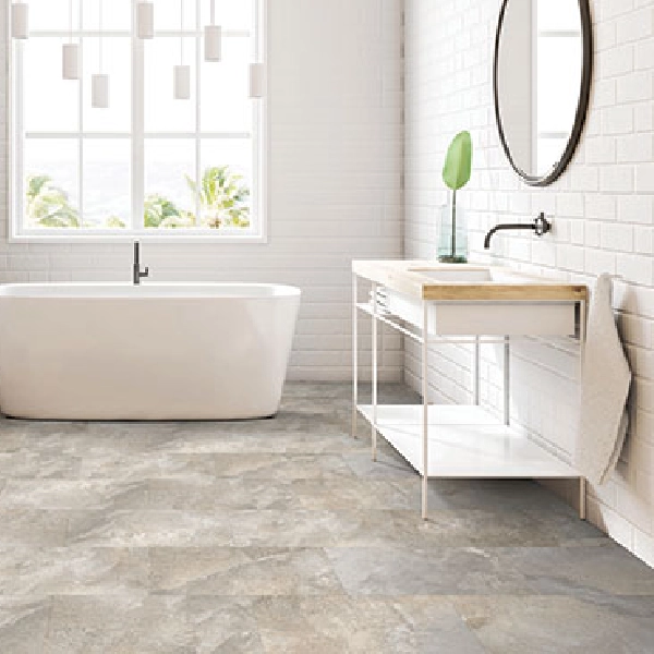 Grey stone-effect waterproof vinyl click flooring in a modern bathroom