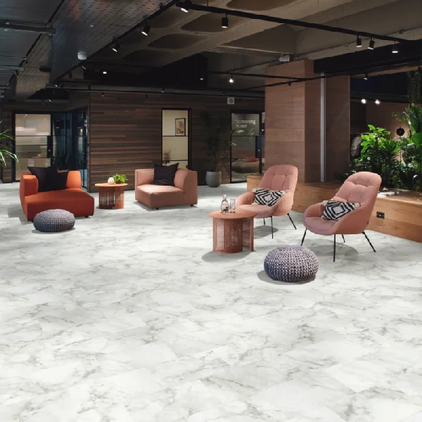 Hotel lounge with white marble-look vinyl floor tiles.