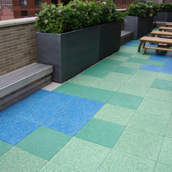 Interlocking TPV rubber tiles in shades of blue and green