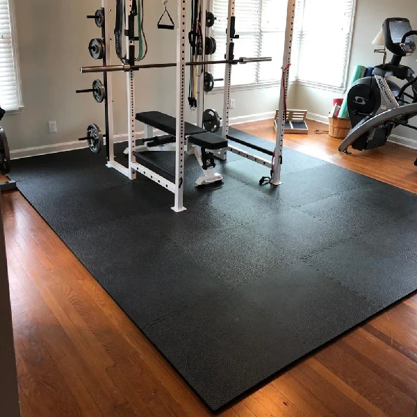 Large square of black interlocking rubber gym floor mats