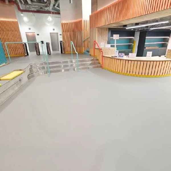 Light gray resin floor in a modern lobby.