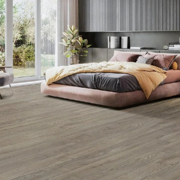 Light grey HDF laminate wood flooring with a subtle grain texture