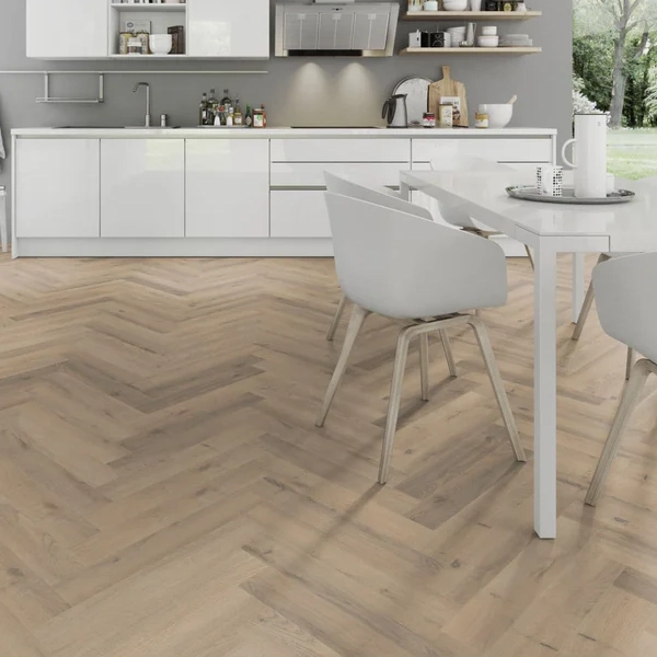 Light wood herringbone vinyl flooring in modern kitchen