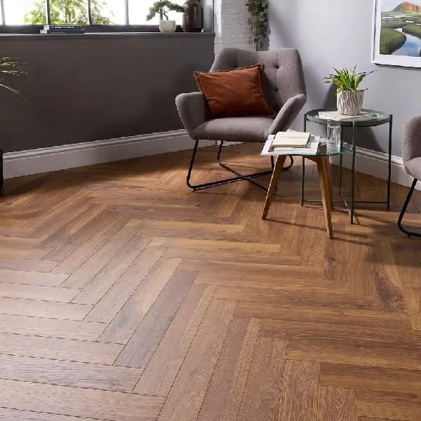 Medium-toned brown herringbone pattern laminate flooring