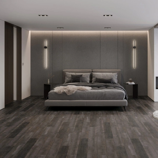 Modern bedroom with dark gray vinyl plank flooring.
