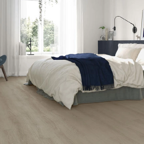 smooth wood-look vinyl flooring in a bright bedroom.