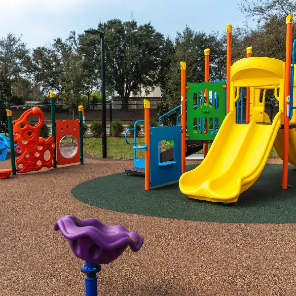 TPV safety flooring beneath a brightly colored playground