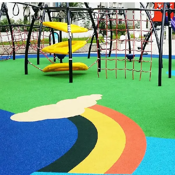 TPV safety flooring with a colorful rainbow design beneath a hotel playground climbing structure.