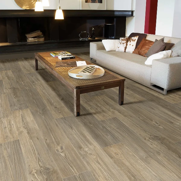 Weathered gray-brown wood-effect vinyl plank flooring