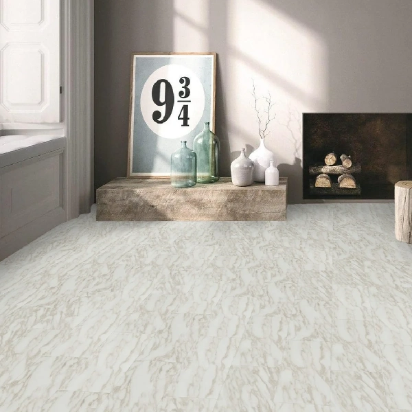 White and beige swirled patterned vinyl click flooring in a decorative room.