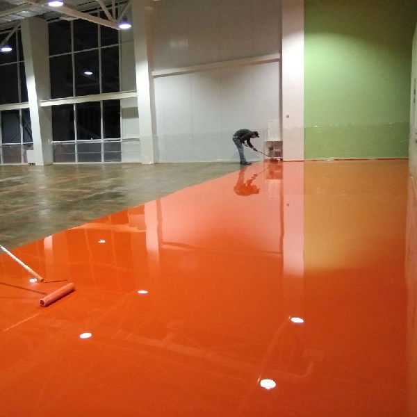 glossy orange epoxy coating to a large warehouse floor