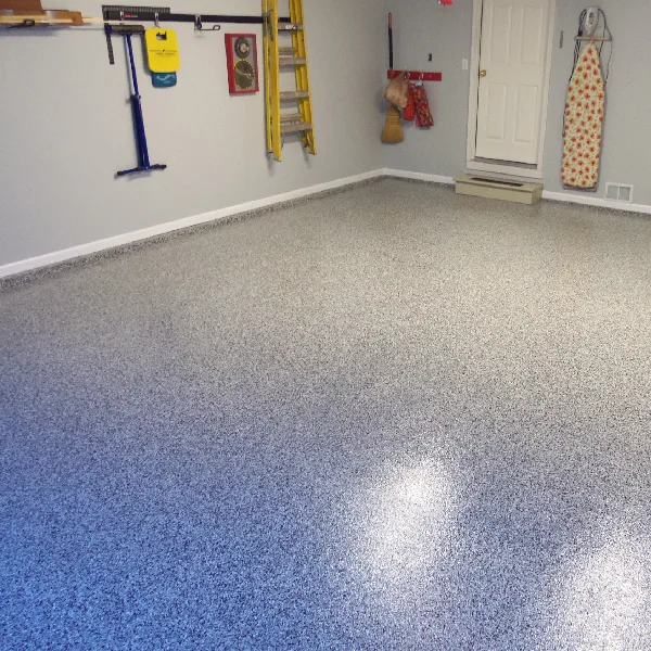grey flake epoxy garage floor with white trim and light gray walls