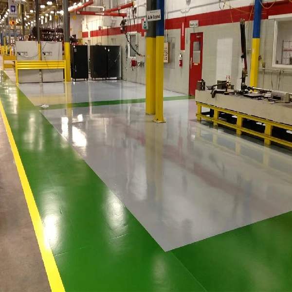 light gray industrial epoxy floor with a bright green pedestrian walkway