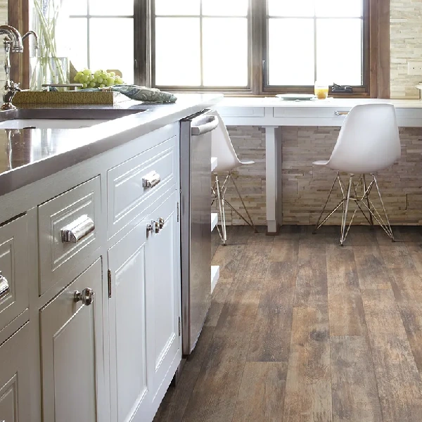 multi-toned brown laminate flooring installed in a modern kitchen