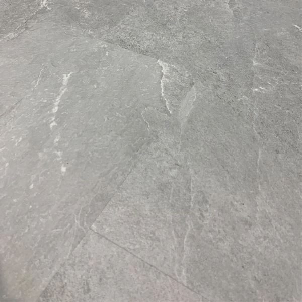 texture of grey slate-effect vinyl click flooring.